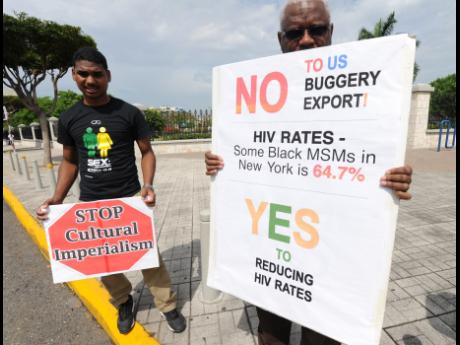Love March Movement protesters outside the US Embassy in 2015 holding signs during the visit of a US gay rights envoy